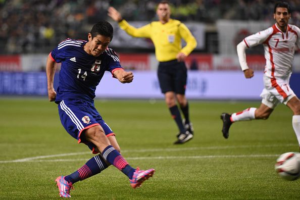 OITA, JAPAN - MARCH 27:Yoshinori Muto of Japan shoots the ball during the international friendly match between Japan and Tunisia at Oita Bank Dome on March 27, 2015 in Oita, Japan.  (Photo by Kaz Photography/Getty Images)