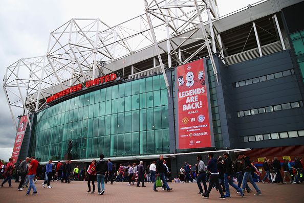 MANCHESTER, ENGLAND - MAY 17: Fans walk outside the stadium prior to the Barclays Premier League match between Manchester United and Arsenal at Old Trafford on May 17, 2015 in Manchester, England. (Photo by Clive Rose/Getty Images)