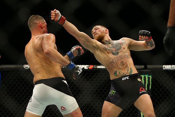 LAS VEGAS, NV - MARCH 5: Conor McGregor (R) punches Nate Diaz during UFC 196 at the MGM Grand Garden Arena on March 5, 2016 in Las Vegas, Nevada. (Photo by Rey Del Rio/Getty Images)