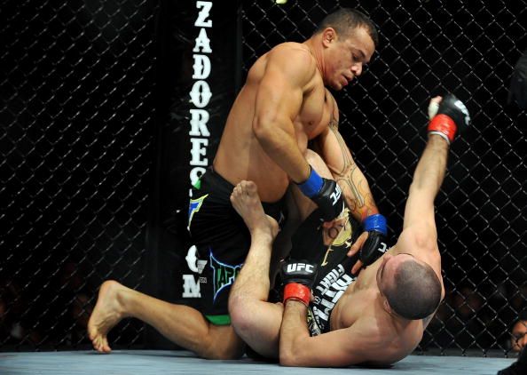 LOS ANGELES, CA - OCTOBER 24: UFC fighter Gleison Tibau (top) battles with UFC fighter Josh Neer during their Lightweight "Swing" bout at UFC 104: Machida vs. Shogun at Staples Center on October 24, 2009 in Los Angeles, California. (Photo by Jon Kopaloff/Getty Images)