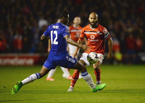WALSALL, ENGLAND - SEPTEMBER 23: Adam Chambers of Walsall is faced by John Obi Mikel of Chelsea during the Capital One Cup third round match between Walsall and Chelsea at Banks's Stadium on September 23, 2015 in Walsall, England. (Photo by Nigel Roddis/Getty Images)