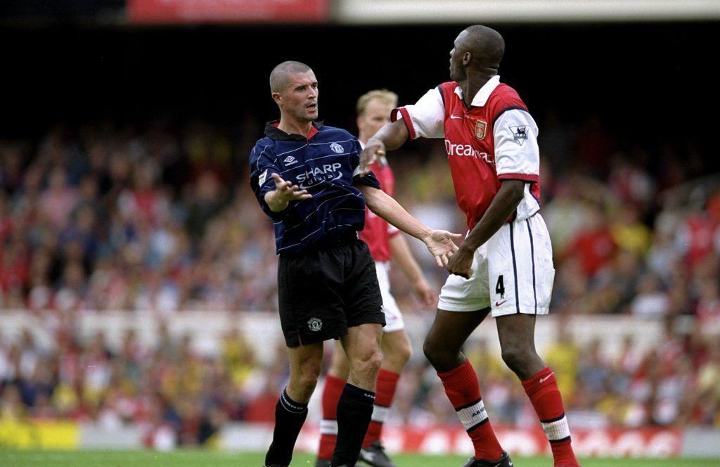 22 Aug 1999:  Roy Keane of Manchester United clashes with Patrick Vieira of Arsenal during the FA Carling Premiership match against Arsenal played at Highbury in London, England.  The match finished in a 2-1 win to Manchester United.   Mandatory Credit:Clive Brunskill /Allsport