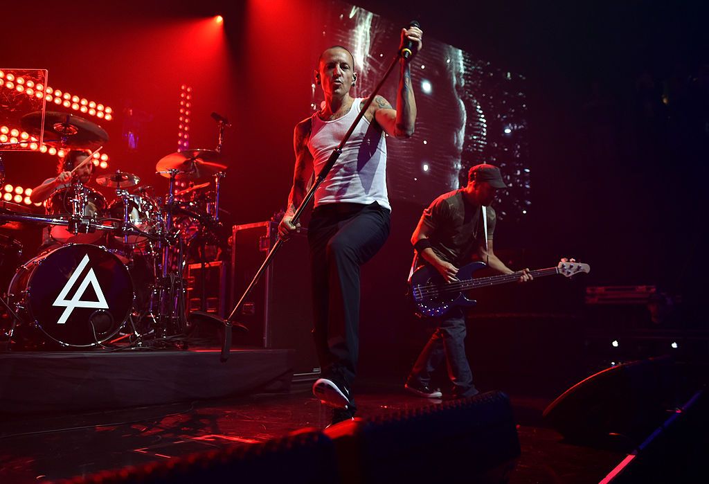 BURBANK, CA - JUNE 18: (L-R) Musician Rob Bourdon, singer Chester Bennington and musician Dave Farrell perform onstage during the iHeartRadio album release party with Linkin Park presented by Clear Channel at the iHeartRadio Theater on June 18, 2014 in Burbank, California. (Photo by Kevin Winter/Getty Images for Clear Channel)