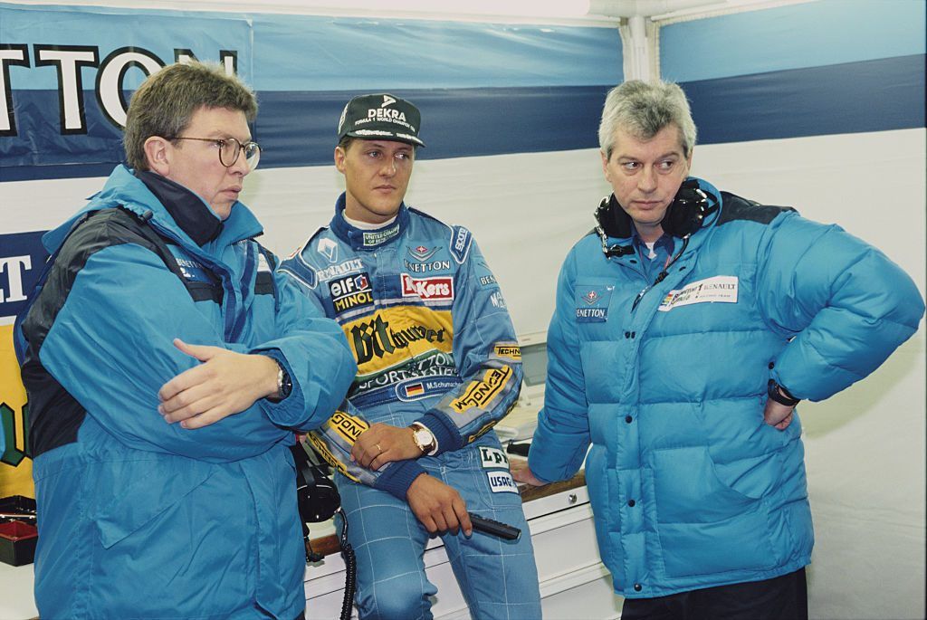 Michael Schumacher of Germany, driver of the #1 Mild Seven Benetton Ford Benetton B195 Renault V10 talking with team technical director Ross Brawn ( L) and race engineer Pat Symonds during practice for theEuropean Grand Prix on 1 October 1995 at the Nurburgring, Nurburg, Germany. (Photo by Pascal Rondeau/Getty Images)