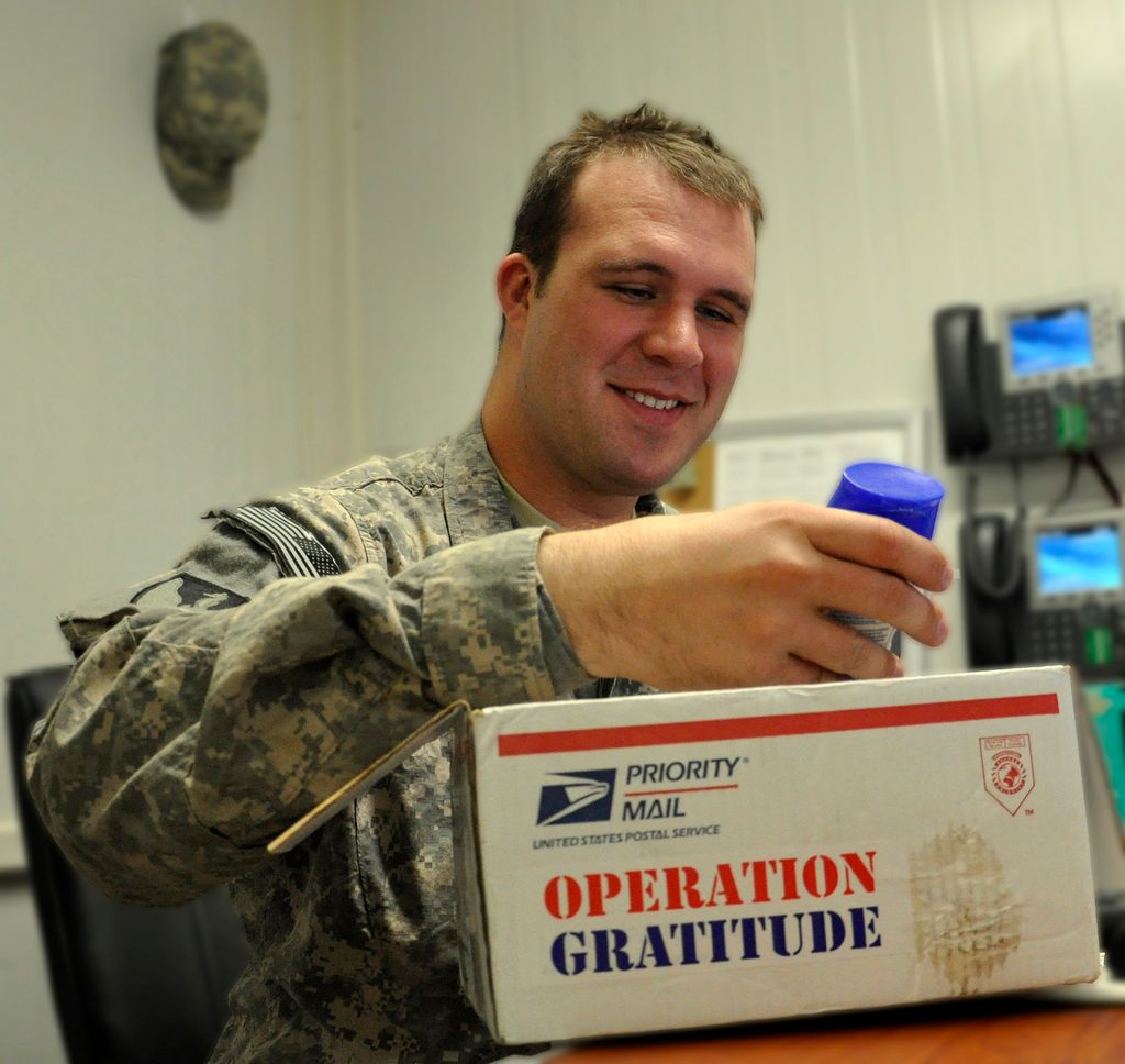 Christopher Ericson, assistant operations officer with the 579th Engineer Detachment FEST-M), received a surprise care package from Operation Gratitude, which is a non-profit organization that seeks to lift morale and put smiles on faces by sending care packages addressed to individual Soldiers, Sailors, Airmen and Marines deployed in harm's way. Through Collection Drives, Letter Writing Campaigns and Donations of funds for shipping expenses, Operation Gratitude provides civilians anywhere in America a way to express their respect and appreciation to the men and women of the U.S. Military in an active, hands-on manner. (Photo by Mark Abueg)