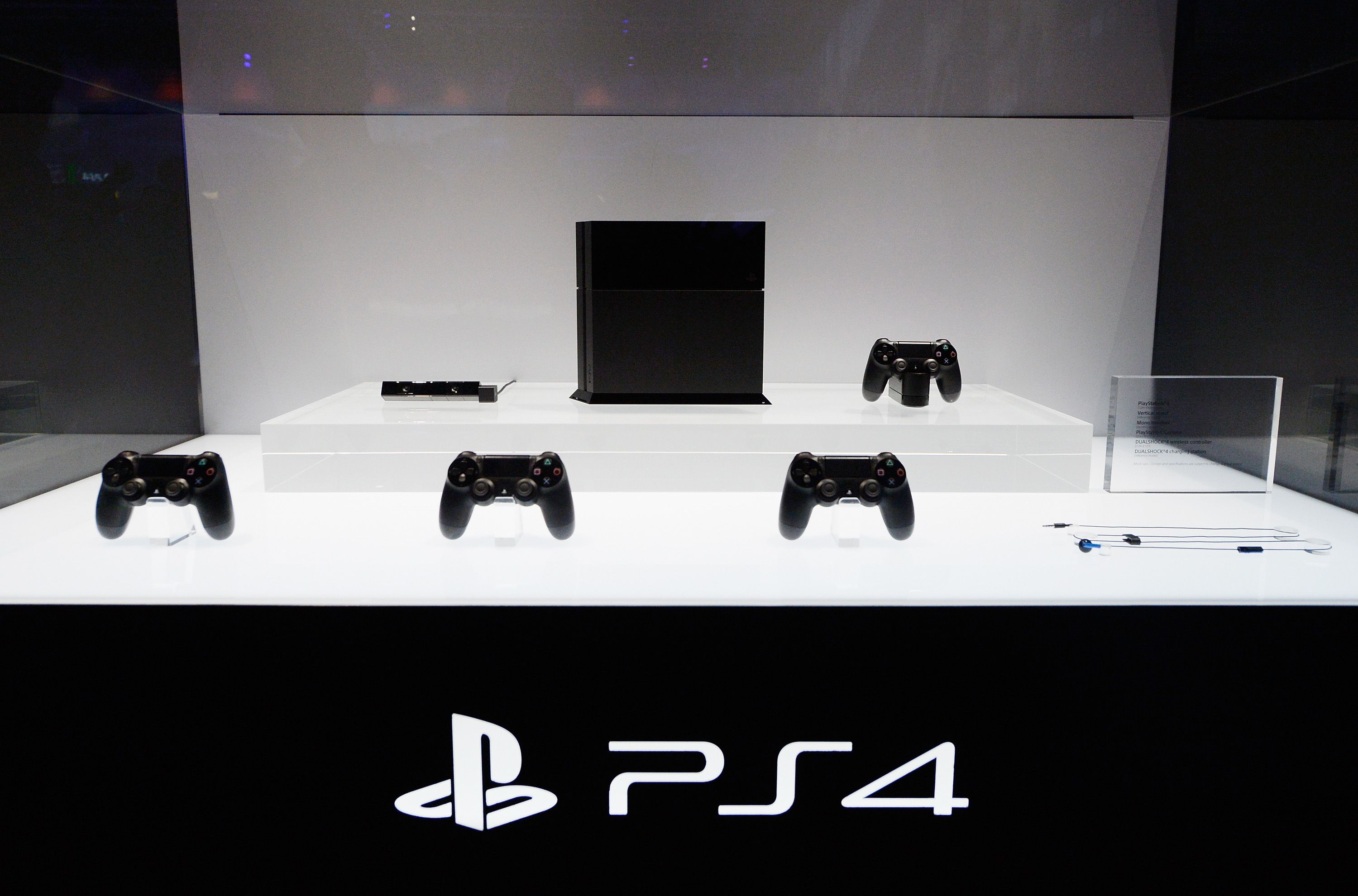 LOS ANGELES, CA - JUNE 11: A Playstation 4 and its controllers on display at the Sony Playstation E3 2013 booth at the Los Angeles Convention Center on June 11, 2013 in Los Angeles, California. Thousands are expected to attend the annual three-day convention to see the latest games and announcements from the gaming industry. 