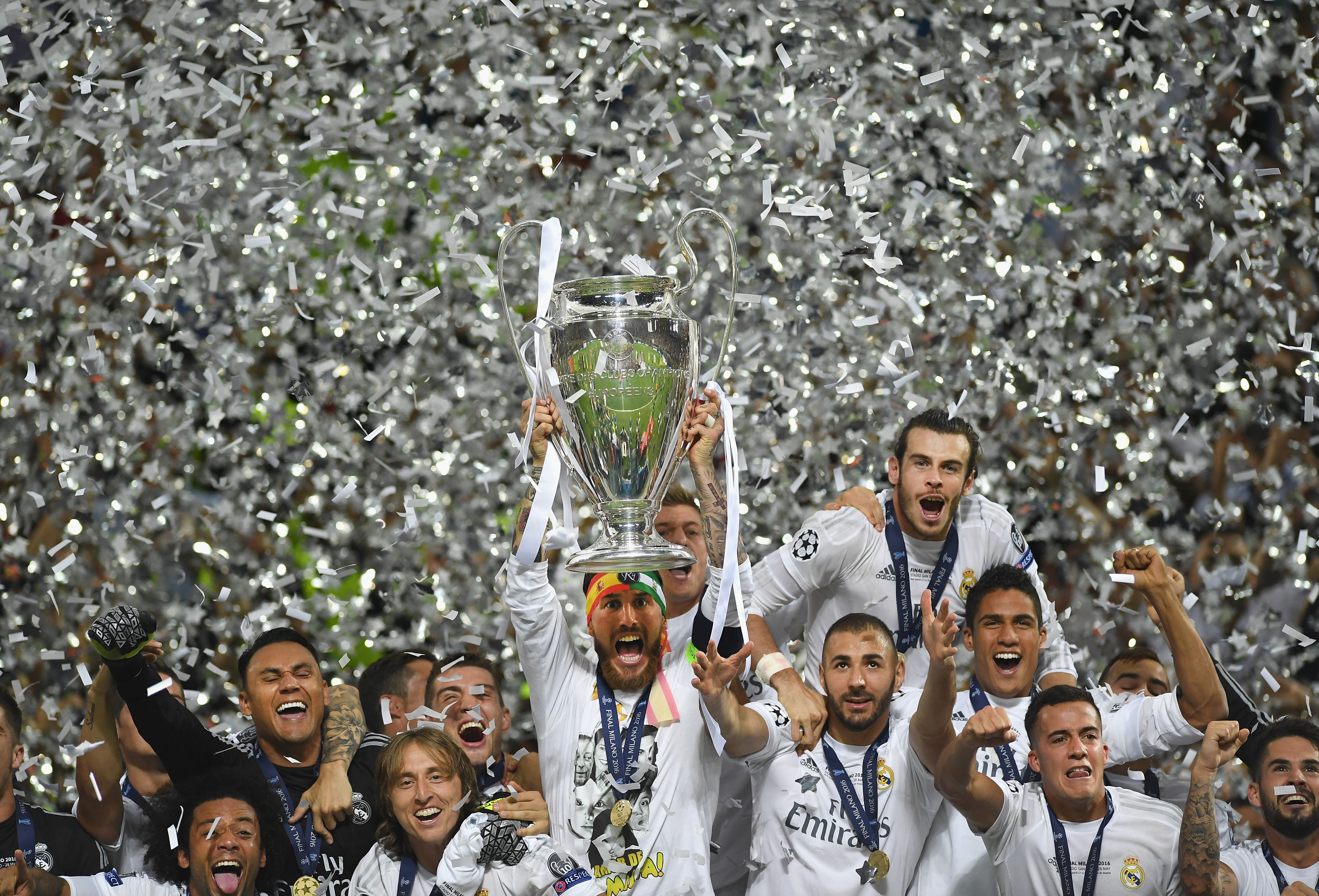 MILAN, ITALY - MAY 28: Sergio Ramos of Real Madrid lifts the Champions League trophy after victory in the UEFA Champions League Final match between Real Madrid and Club Atletico de Madrid at Stadio Giuseppe Meazza on May 28, 2016 in Milan, Italy.