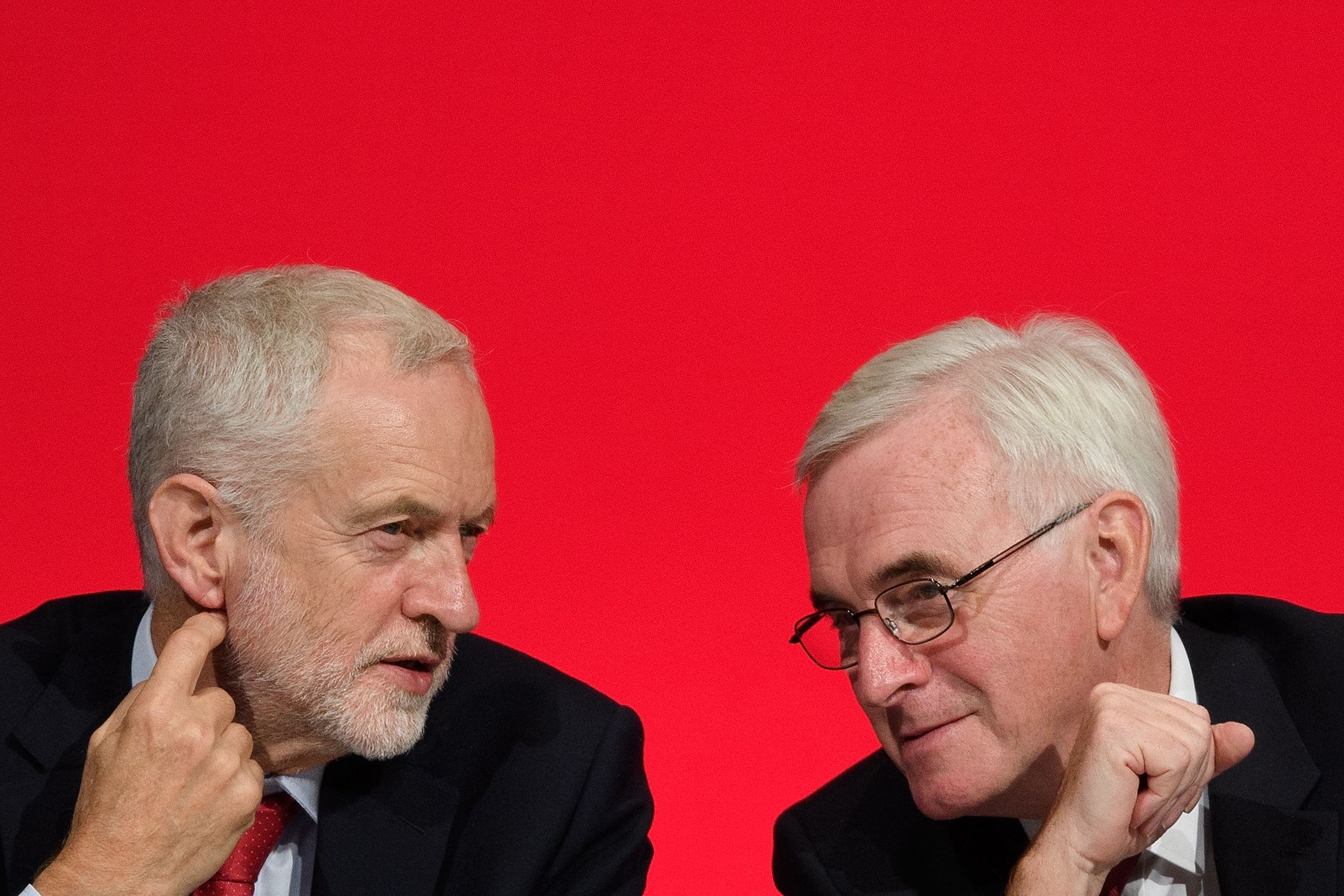 LIVERPOOL, ENGLAND - SEPTEMBER 24: Labour Party leader Jeremy Corbyn (L) sits with Shadow Chancellor of the Exchequer John McDonnell ahead of McDonnell's speech to delegates in the Exhibition Centre Liverpool during day two of the annual Labour Party conference on September 24, 2018 in Liverpool, England. Labour's official slogan for the conference is ?Rebuilding Britain, for the many, not the few?. (Photo by Leon Neal/Getty Images)