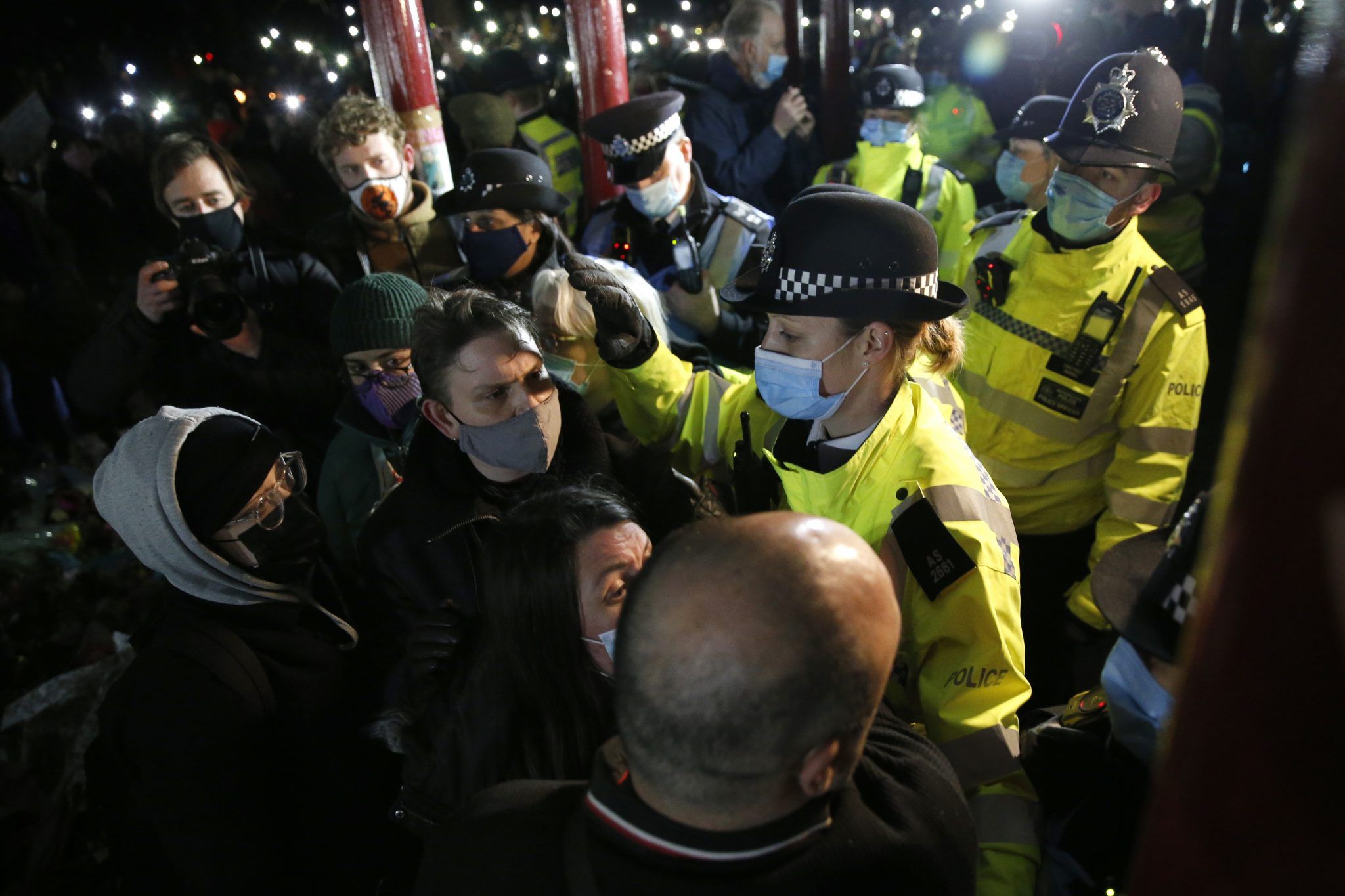 Police clash with mourners at a vigil for Sarah Everard on Clapham Common