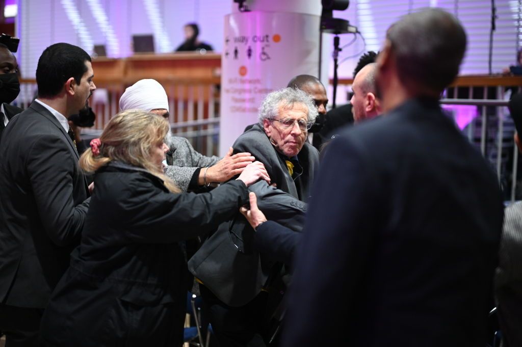 Piers Corbyn being escorted out of People's Question Time