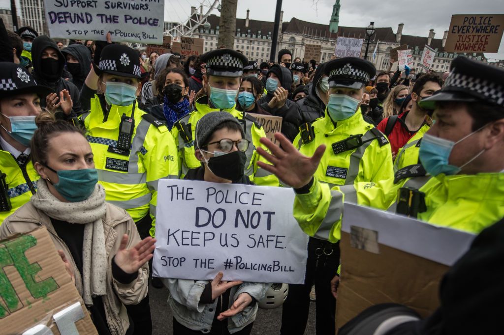 Protestors demonstrate outside Scotland Yard over the treatment of people by police at the Sarah Everard vigil the day before on March 14, 2021 (Getty)