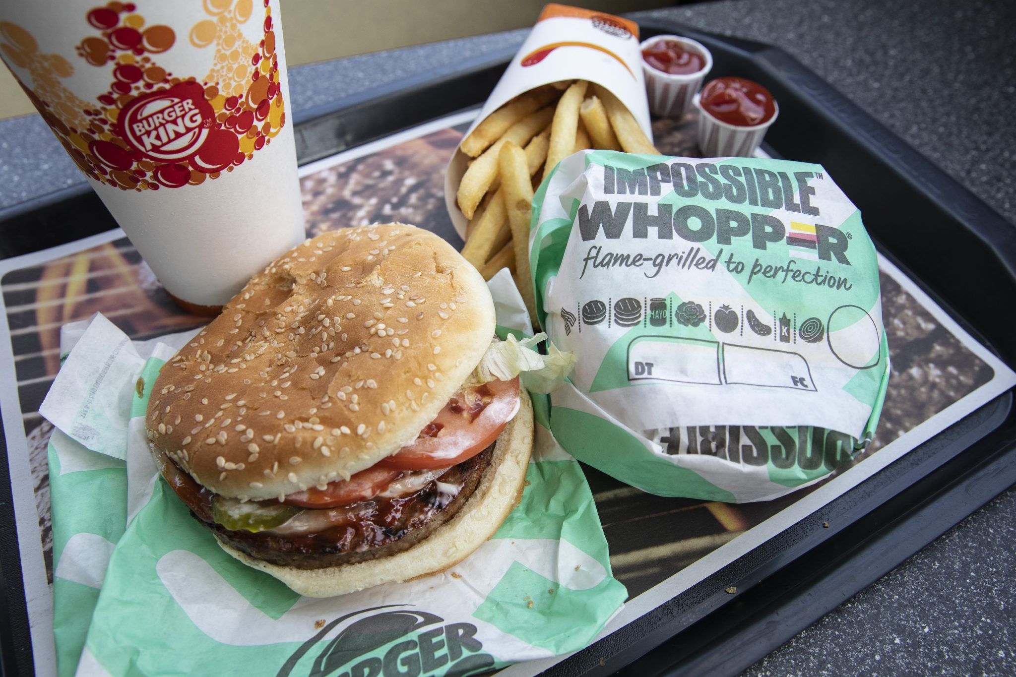 NEW YORK, NY - AUGUST 8: In this photo illustration, the new Impossible Whopper sits on a table at a Burger King restaurant on August 8, 2019 in the Brooklyn borough of New York City. On Thursday, Burger King is launching its soy-based Impossible Whopper at locations nationwide. The meatless patties are produced by California tech startup Impossible Foods. A single Impossible Whopper sandwich costs $5.99. (Photo by Drew Angerer/Getty Images)